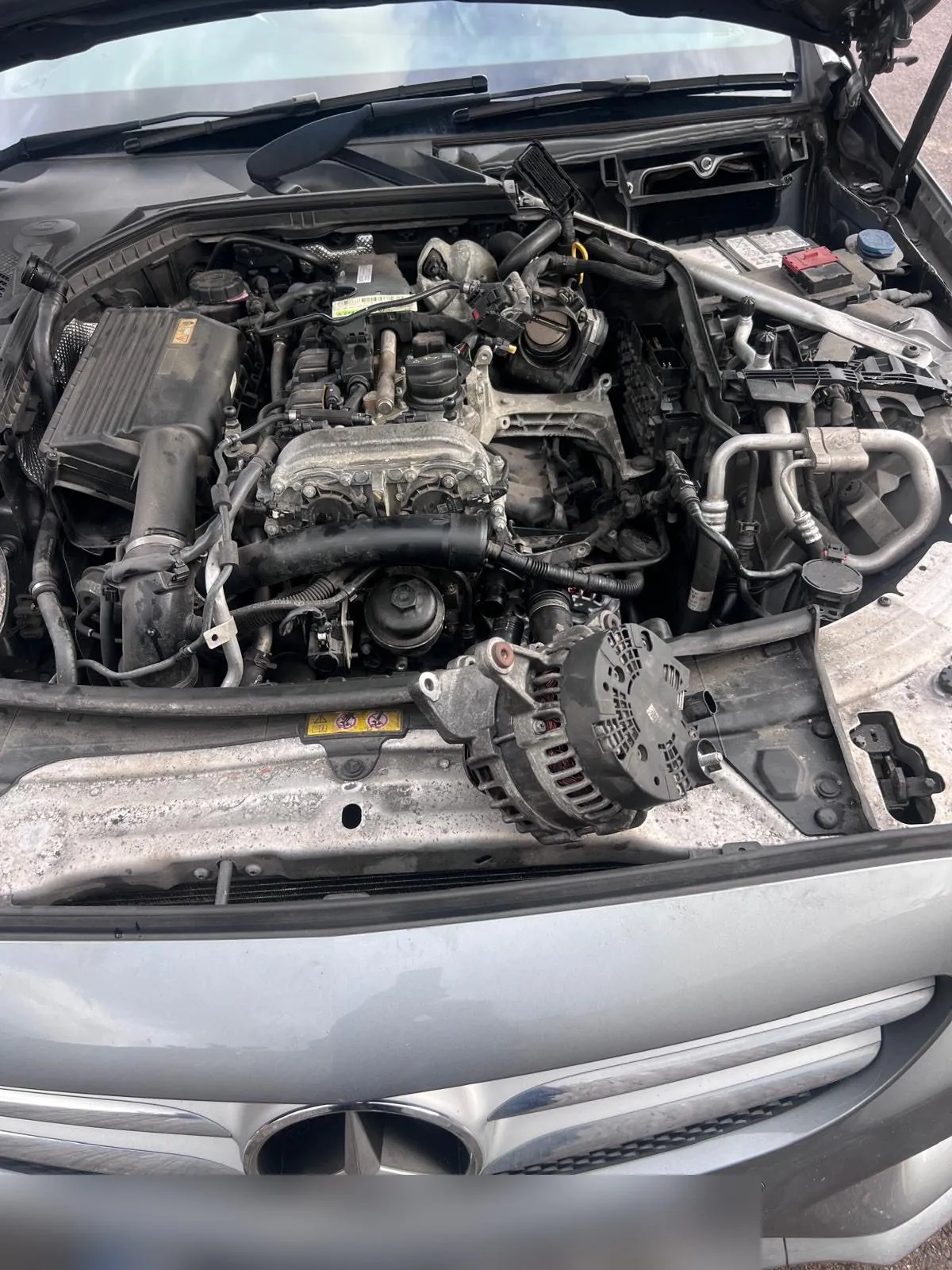 Mercedes, alternator being fitted